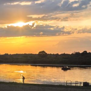 Evening Landscape: Sunset Over A Small River