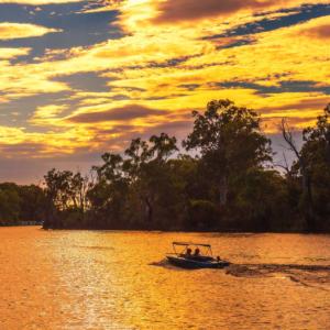 Sunset Over Murray River With People Riding A Boat In Mildura, A